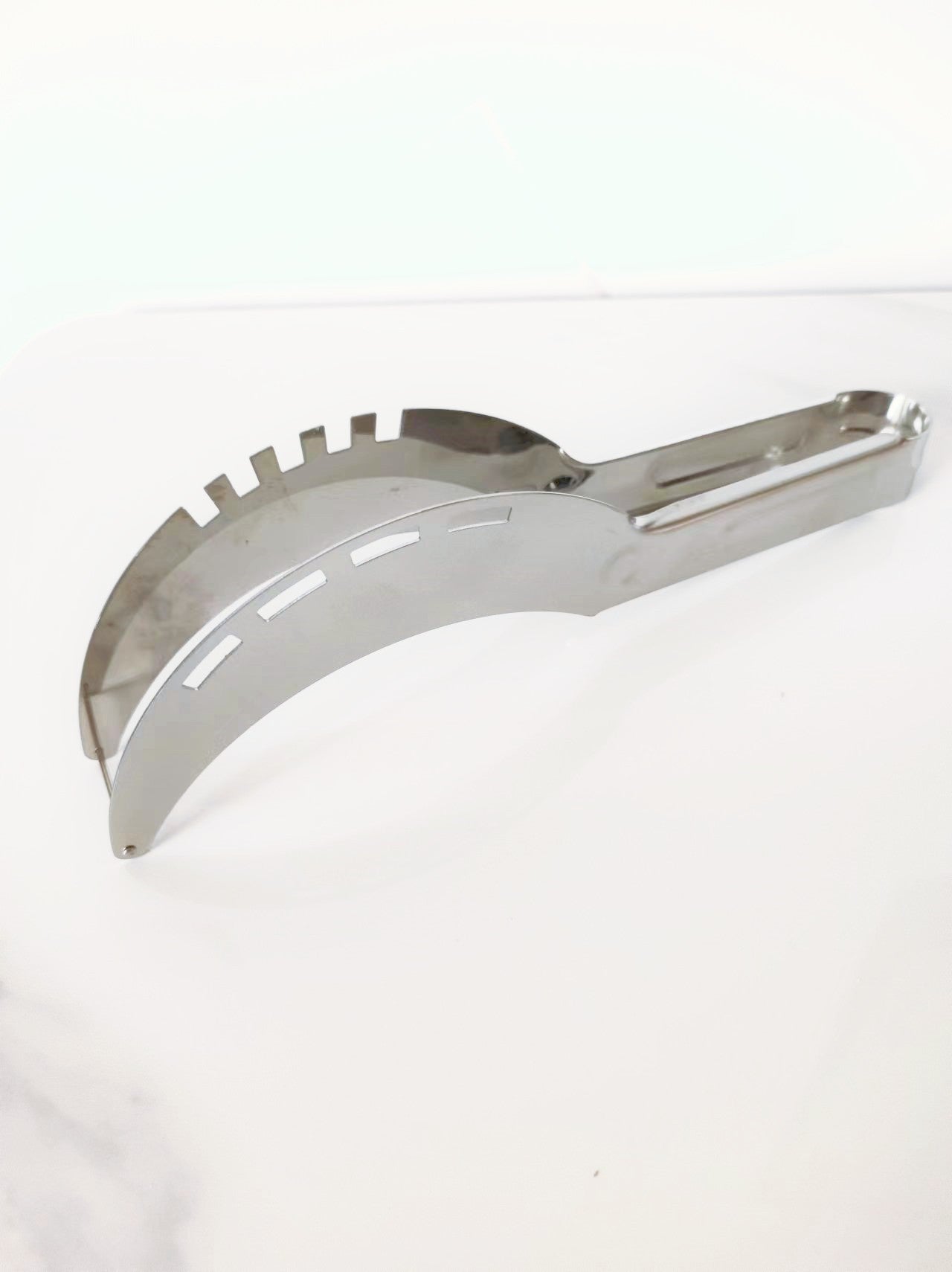 A stainless steel watermelon cutting tool