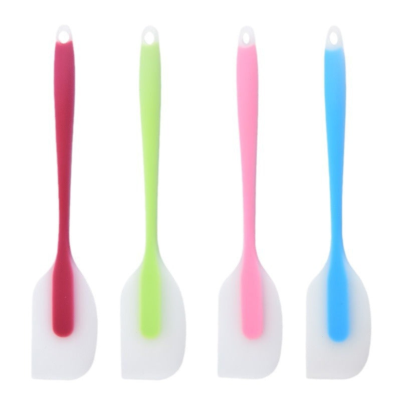 One-piece cream silicone scraper